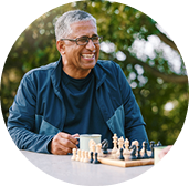 Man playing chess in community